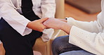 Closeup, doctor and patient holding hands, healthcare and wellness with support and comfort. Medical, professional and consultation with grief or loss with help or compassion with diagnosis or clinic