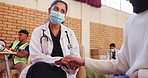 Doctor, holding hands and woman support patient for healthcare, consultation or kindness of volunteer in mask at charity. Medical professional, comfort or person in clinic for help, empathy and trust