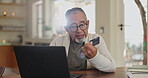 Senior man, credit card and laptop for payment in home, ecommerce and internet banking for transaction. Elderly male person, finance and typing account number on website, online and investment