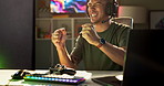 Gaming, video game and man celebrate at night for entertainment, online games and esports. Gamer, winner and person with headphones, neon and controller for virtual media, streaming and competition