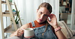 Woman, coffee and thinking with stress on sofa for decision, future or frustrated with drink in home. Girl, person and student with tea on couch with anxiety, idea or worry for exam results in house