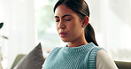 Woman, sofa and breathing calm for discomfort of pain or anxiety, mental health and depression with eyes closed. Female person, nerves and uncomfortable on couch with abdominal or stomach cramps.