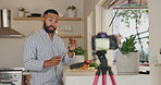 Man, cooking and live streaming with talking in kitchen for video, post or vlog for class, nutrition or diet in home. Person, influencer or chef with vegetables, food or recording for social network
