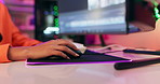 Hand, mouse and woman playing video game on computer in futuristic space for cyber geek. Neon lights, gamer and closeup of female person gaming online with desktop and technology equipment in office.