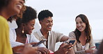 Phone, talking or group of friends on beach for outdoor travel, holiday or vacation in Miami on social media. Streaming, news or people at ocean or sea on mobile app for sharing or browsing online 