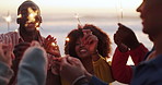 Happy, friends and sparklers at dusk for celebration, outdoor with fireworks for new years eve. Diverse, group and hands for reunion on vacation, holiday or summer break at sunset for community 