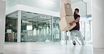 Delivery man, boxes and falling with package for accident, misstep and injury or mistake in a building or office. Courier worker or person with fragile stock for distribution risk, safety or balance