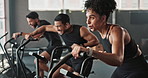 Fitness, group of people and workout on cycling bikes at gym for stability, health and wellness with sports. Friends, men and woman with exercise equipment, machine and active for cardio as hobby