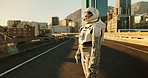Space, travel and astronaut in city with street, future dystopia and planet for discovery. Earth, aerospace mission and person in helmet on urban adventure for research, science and sci fi universe