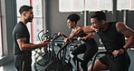 People, instructor and bicycle in gym for exercise, high five in training class for body wellness with workout goal. Coach, cardiovascular fitness or joint mobility, client progress and gym equipment