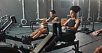 Exercise, rowing machine and friends in gym for practice, wellness or sports for body health. Club, group and people workout on ergometer for fitness, muscle and cross training for cardio together