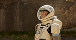 Astronaut, environment and explore nature for mission adventure or research trip, planet earth or travel. Person, helmet and outdoor journey in spacesuit for expedition discovery, mountain or global