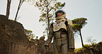 Planet, travel and astronaut walking in forest to explore abandoned world, planet and universe. Space suit, futuristic fantasy and spaceman in alien environment for exploration, adventure and journey