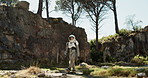 Planet, travel and astronaut walking in nature to explore abandoned world, planet and universe. Space suit, futuristic fantasy and spaceman in alien environment for exploration, adventure and journey