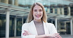Happy, laughing and arms crossed with business woman outdoor at office in city for comedy or humor. Portrait, smile and street with funny employee in urban town for carefree reaction to good news