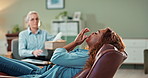 Therapy, counseling and woman on sofa with crying, trauma or stress in ketamine ptsd treatment. Mental health, medical advice and girl with therapist, tissue or consultation in alternative medicine