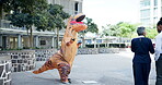 Costume, dance and city with performance, urban office building and documents for work. Mascot, inflatable dinosaur and fun for entertainment, company culture and prank with funny business joke