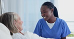 Nurse, patient and smile in bed for good news or results with support and trust in healthcare. Senior woman, medical professional and happy for update on health, illness and treatment in hospital
