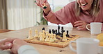 Senior couple, smile and chess on board with winning, problem solving or happy for achievement. Marriage, retirement and excited elderly woman with game contest for knowledge, competition or strategy