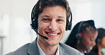 Smile, face or happy man in call center for customer service, tech support or consulting advice. Portrait, agent or friendly consultant in telemarketing, CRM or telecom company in headset for sales