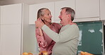 Dance, happy and senior couple in kitchen, cook and love in retirement home. Care, support and enjoyment for elderly married people and fun in house, romance and embrace for bonding time with music
