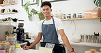 Cafe, portrait of barista and apron with smile for coffee preparation, serving and behind counter to interact with customers. Business owner, employee and service with expresso machine for beverages