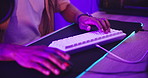 Hands, keyboard and gamer streaming battle, esports contest or tournament with computer at home. Neon light, fast or speed with content creation, person and pro gaming for social media with internet