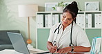 Laptop, doctor and woman writing notes in book for healthcare report, research or information. Computer, notebook or happy medical professional planning schedule, prescription or results in hospital