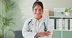 Face, doctor and woman with arms crossed, smile and office with healthcare and professional. Portrait, general practioner and physician with confidence and medical with stethoscope and 