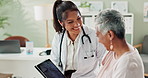 Consultation, tablet and doctor with elderly patient in hospital office for diagnosis, surgery or treatment. Discussion, medical and healthcare worker with woman with digital technology in clinic.
