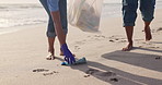 Volunteer, beach and cleaning garbage for environment community service for pollution, plastic or waste management. People, climate change and nature ocean for recycling, global warming or teamwork