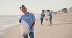 Volunteer, beach or happy woman with plastic bag for sustainability, help or ocean cleaning project. Accountability, portrait and volunteer at sea for earth day, social responsibility or NGO charity