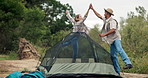 Man, woman and tent or pitching in forest for camping, wilderness and nature and relaxation. Couple, setting up and hand or high five for hiking in park, woods and recreation with trees for adventure