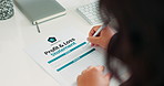 Person, hands and writing with documents in finance for profit, loss or investment on desk at office. Closeup of trader, broker or accountant filling in financial form, statement or policy contract
