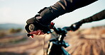 Closeup, hands or bicycle in fitness, extreme sports or adventure as wellness break in nature. Rider, gloves or cycling in countryside, trip or off road as cardio performance, exercise or training