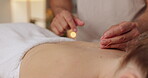 Woman, closeup and back with acupuncture needle for massage, alternative medicine and muscle healing. Relax, patient and person with physical therapy for tension, pain and holistic body treatment
