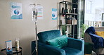 Clinic interior, iv drip and equipment for healthcare, services and medicine by sofa in patient lounge. Furniture, pharmaceutical and liquid in bag for wellness with medical tools by couch in room