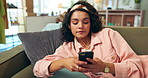 Annoyed, girl and relax on sofa with smartphone for reading text and feeling upset for bad news or disappointment. Woman, home and breathe for calm or frustrated for social media post and message.