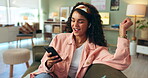 Girl, home and sofa on smartphone with music on earphones, playlist and happy for entertainment. Female person, lounge and couch on internet for streaming service or social media and online video