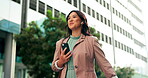 Asian woman, phone call and earphones in city, speaking and networking for company deal. Female person, talking and app for communication in urban town, travel and consultant for contact on commute