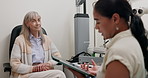 Doctor, office and woman with tablet in consultation with patient at optometrist for eye exam on insurance. Optometry, technology and patient trust results or advice from specialist in healthcare