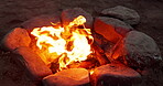 Campfire, wood and flames or closeup with camping for bbq, light and circle outdoor in woods for adventure. Bonfire, burning fire and charcoal for barbecue, heat and cooking for survival in nature