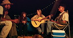 Camping, guitar and friends at night to relax together for adventure, bonding or weekend getaway. Nature, sing and group of young people playing instrument for music on campsite for vacation