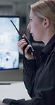 Security, woman and radio in control room for communication, contact or report on night watch for safety. Person, agent or guard with info in office for surveillance, talking or protection services