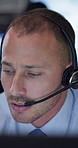 Security, man and headset for talking in control room for listening, reading and problem solving. Person, agent and worker by computer for surveillance, monitor or night watch for protection service