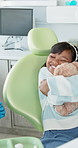 Girl, dentist and hugging with teddy, checkup and comfort for oral hygiene and appointment. Child, healthcare and dental care with smile, gift and orthodontist visit in professional medical clinic