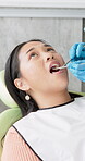 Woman, dentist and examine patient with smile, orthodontist and oral care in clinic with professional. Appointment, gum and teeth inspection for tooth decay, healthy mouth and dental hygiene check