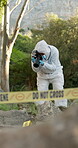 Photography, evidence and person on crime scene for inspection, investigation and proof documentation. Forensic photographer, tape and pictures for observation for problem solving and case research.