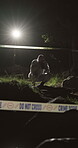 Crime scene, evidence and photograph with forensic team outdoor at night to work on murder case. Accident, investigation and teamwork with people in dark forest for discovery of body or law and order