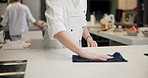 Person, hands and chef and cleaning in kitchen for culinary meal or restaurant hygiene, bacteria or counter. Professional, cook and cloth for hospitality service in health, presentation or cuisine